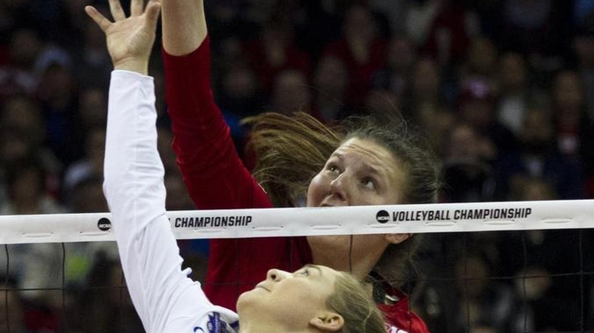 Nebraska’s Mikaela Foecke went up over Florida’s Allie Monserez in the NCAA volleyball championship match Saturday night at the Sprint Center.