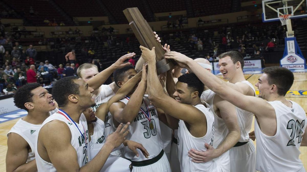 Northwest Missouri State University players celebrated with a trophy after beating University of Central Missouri 69-61in the MIAA Tournament Championship Game Sunday March 5, 2017, at Municipal Auditorium in Kansas City.