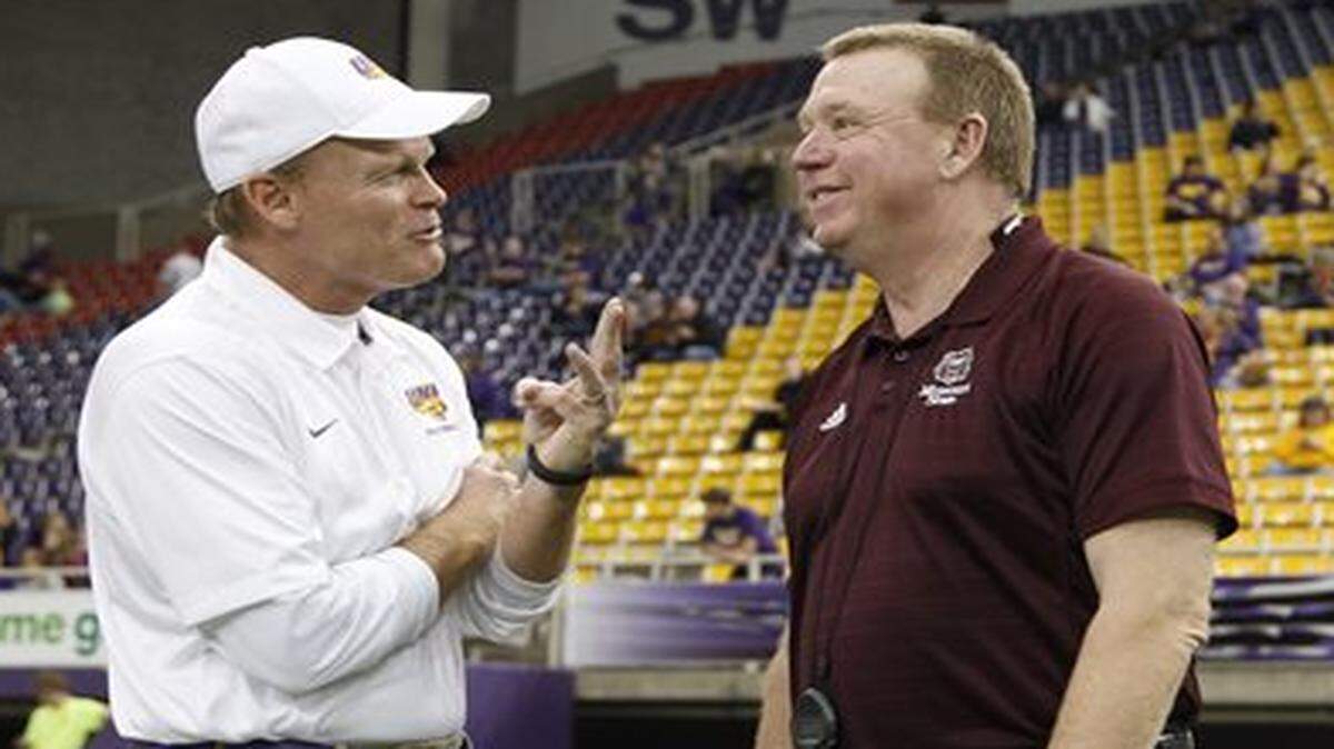 
Terry Allen (right) talked with Northern Iowa coach Mark Farley on Saturday before Allen’s last game as Missouri State’s football coach.
