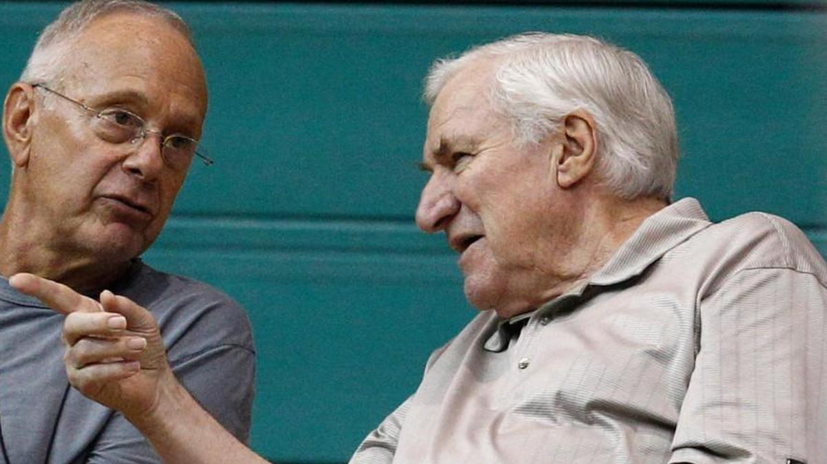 North Carolina coaching legend Dean Smith, right, talked with then-Charlotte Bobcats coach Larry Brown in 2010.