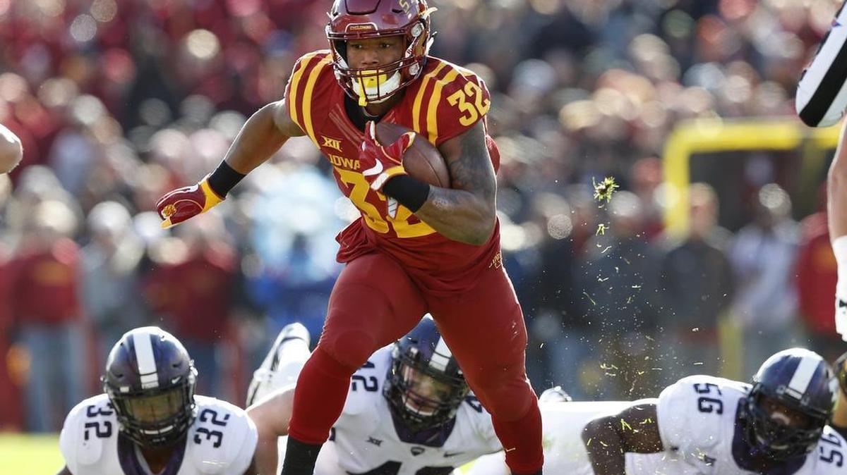 Iowa State running back David Montgomery ran away from TCU defenders Travin Howard (32), Ty Summers (42) and Chris Bradley (56) during the Cyclones’ victory on Oct. 28.