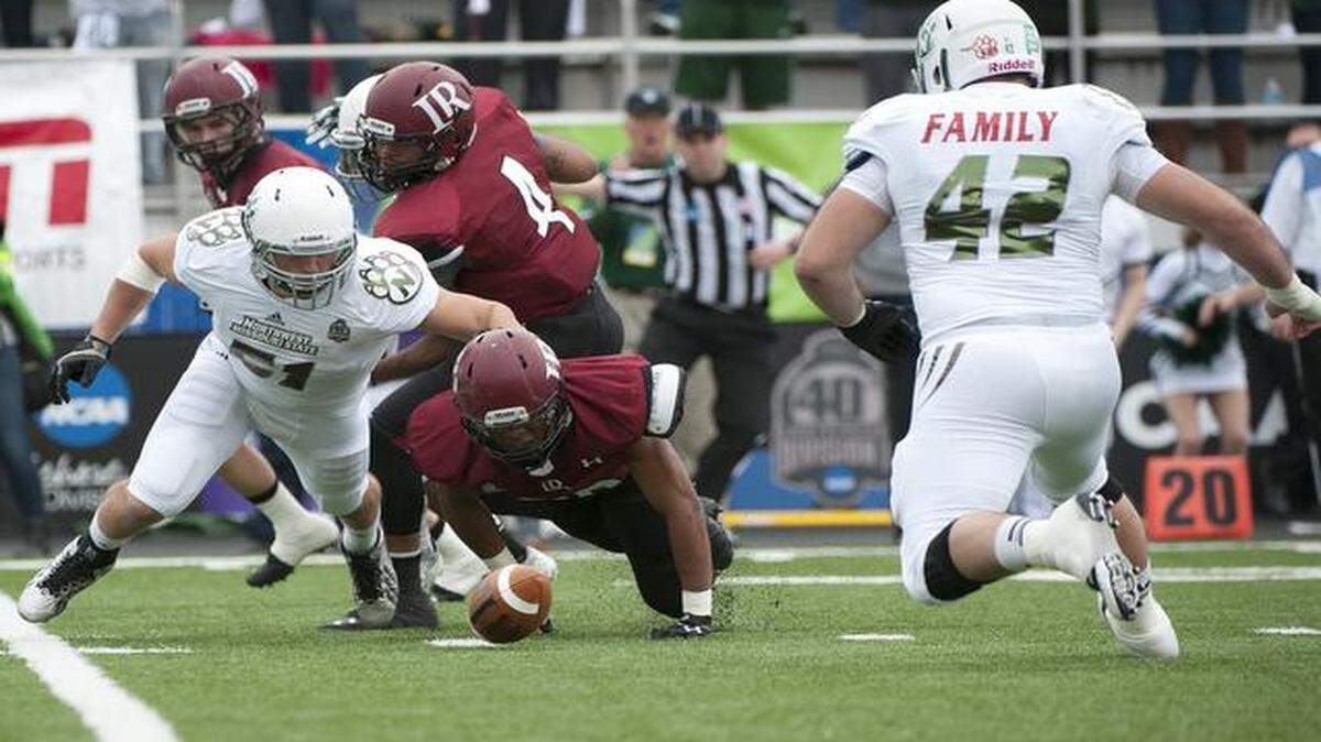 
In last year’s NCAA Division II National Championship Game, Northwest Missouri State linebacker Eric Reimer (left) and Northwest Missouri State defensive tackle Bryant Hummel (right) tried to get the ball after Lenoir-Rhyne University running back Jarrod Spears fumbled.
