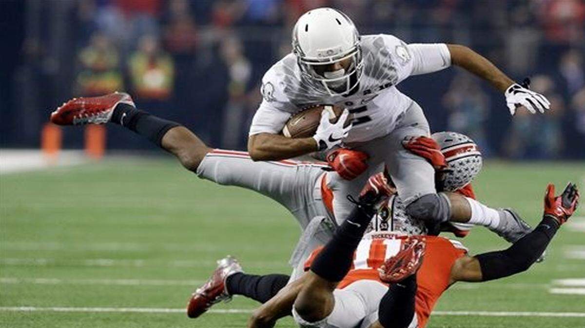 
Oregon wide receiver Charles Nelson runs during the first half of the NCAA college football playoff championship game against Ohio State Monday in Arlington, Texas.
