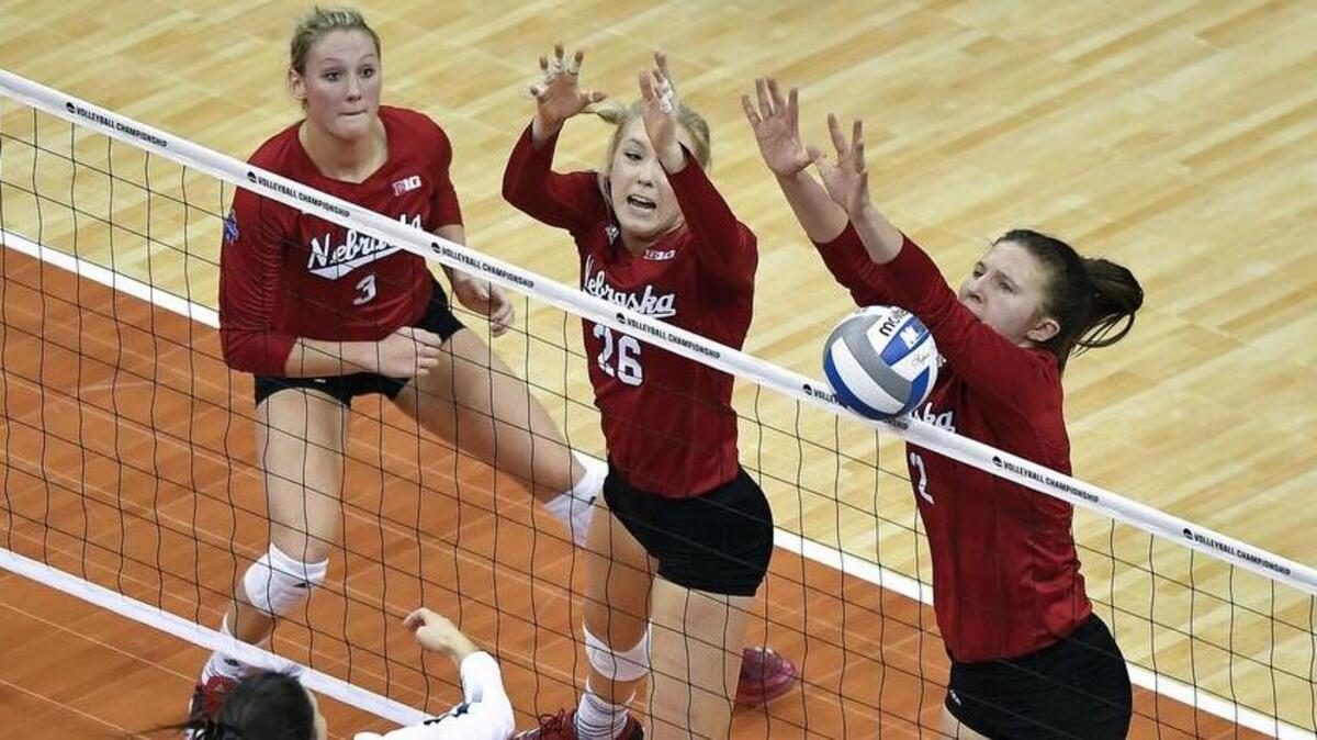 Nebraska outside hitter Mikaela Foecke blocks an attack by Penn State middle blocker Heidi Thelen during the first set during an NCAA national semifinal on Thursday, Dec. 14, 2017, at Sprint Center in Kansas City, Mo.