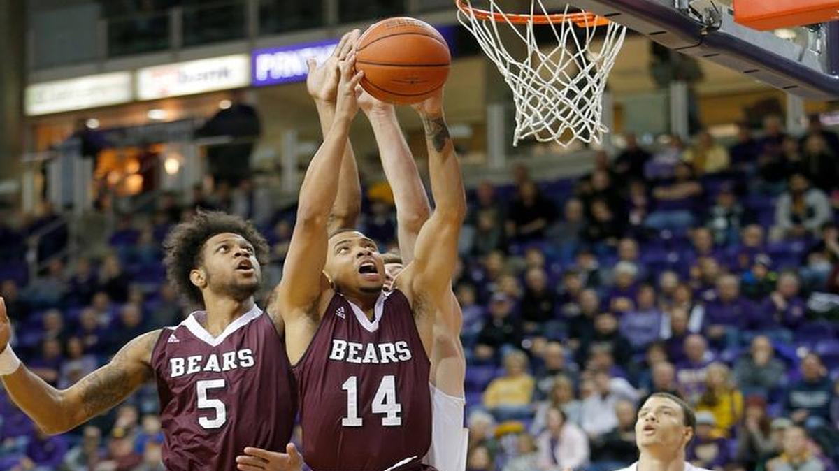 Missouri State’s Obediah Church (5) and Ronnie Rousseau III vie for a rebound with Northern Iowa’s Bennett Koch during the first half Wednesday,.