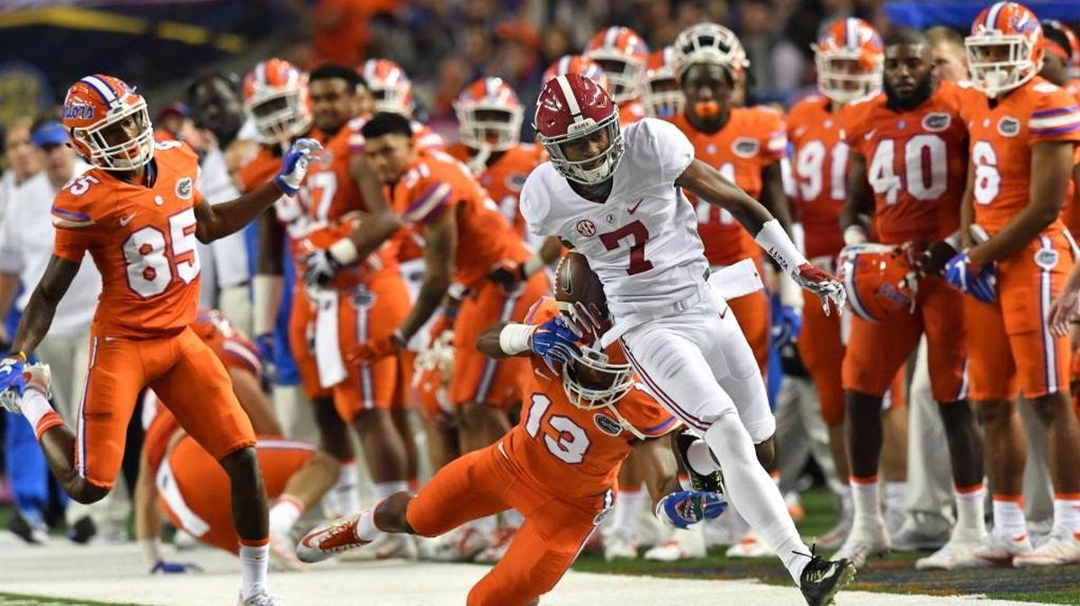 Alabama wide receiver Trevon Diggs (7) is tackled from behind by Florida linebacker Daniel McMillian (13) in the first half during the Southeastern Conference championship at the Georgia Dome in Atlanta on Saturday, Dec. 3, 2016. Alabama won, 54-16.