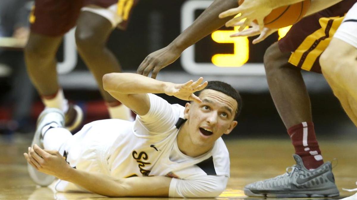 Wichita State guard Landry Shamet manages to get a pass off after getting a loose ball against Loyola during the first half of their game at Koch Arena on Wednesday. (Jan. 11, 2017)