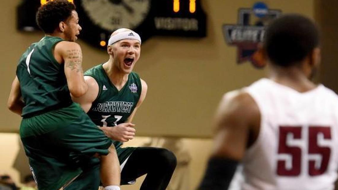 Northwest Missouri State’s Zach Schneider (33) and Justin Pitts, a junior from Blue Springs, celebrate their 71-61 victory over Fairmont State in NCAA Division II championship game Saturday in Sioux Falls, S.D.