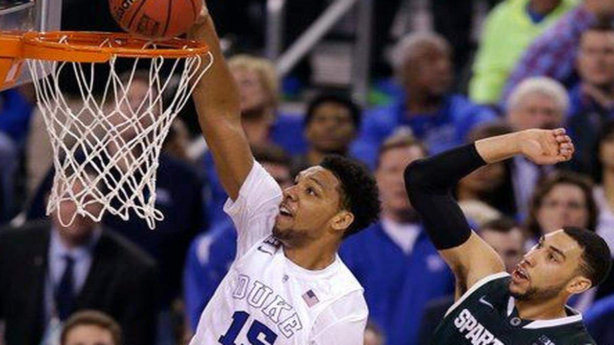 
Duke’s Jahlil Okafor (left) scored 18 points against Michigan State in Saturday’s game.
