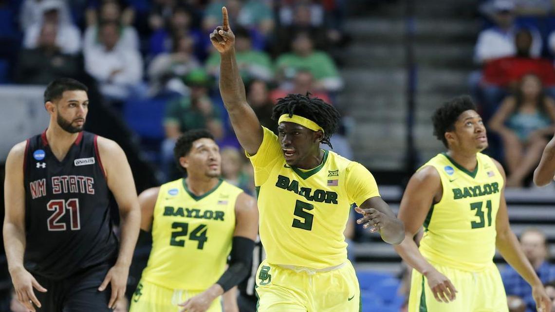Baylor's Johnathan Motley (5) celebrates a New Mexico State turnover as Tanveer Bhullar (21), Ishmail Wainright (24) and Terry Maston (31) watch in the second half of a first-round game in the men's NCAA college basketball tournament in Tulsa, Okla., on Friday March 17, 2017.