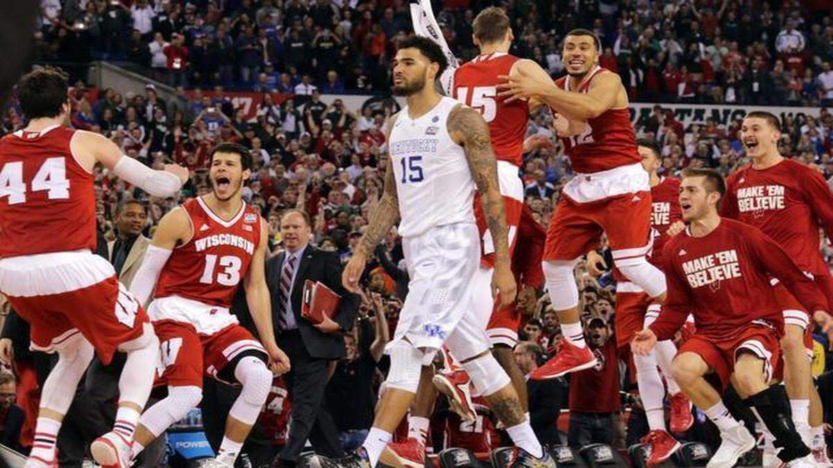 
The Wisconsin reserves celebrated as Kentucky’s Willie Cauley-Stein walked off the court after the Badgers upset the previously unbeaten Wildcats 71-64 on in the NCAA Final Four men’s basketball semifinals Saturday night in Indianapolis. Wisconsin advances to play Duke for the national championship on Monday night.

