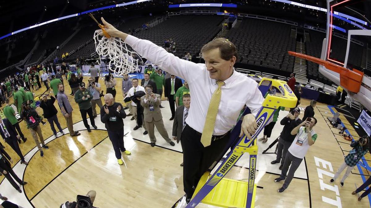 Oregon coach Dana Altman cut down the net after his Ducks beat Kansas in an Elite Eight NCAA Tournament game on Saturday night at Sprint Center.