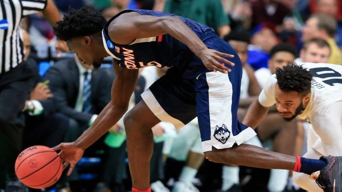 Connecticut’s Daniel Hamilton (left) stole the ball from Colorado’s Tre’Shaun Fletcher in Thursday’s NCAA Tournament game in Des Moines, Iowa.