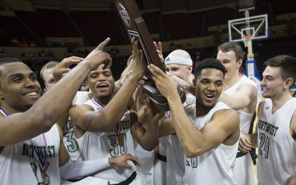 Northwest Missouri State players celebrated with a trophy after beating Central Missouri 69-61in the MIAA Tournament championship game March 5 at Municipal Auditorium in Kansas City.