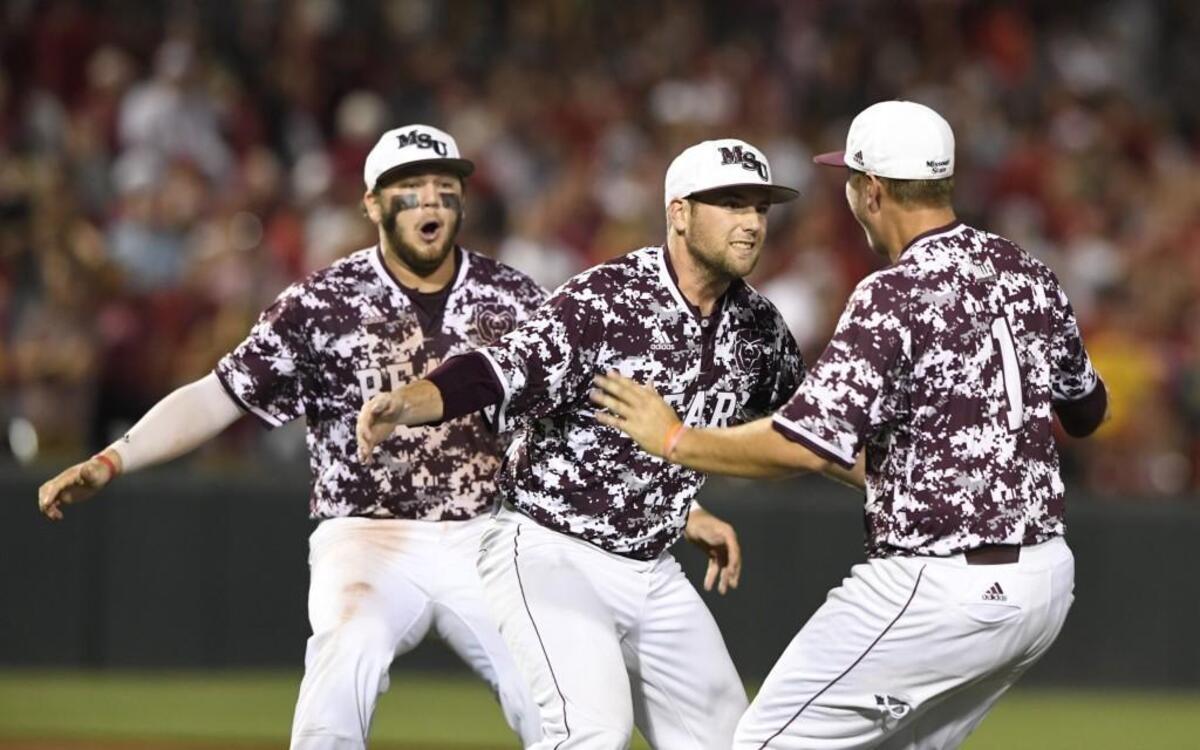 Missouri State’s Jake Burger, left, Jordan Knuston, center, and Justin Paulsen celebrate after beating Arkansas 3-2 in Fayetteville, Ark.