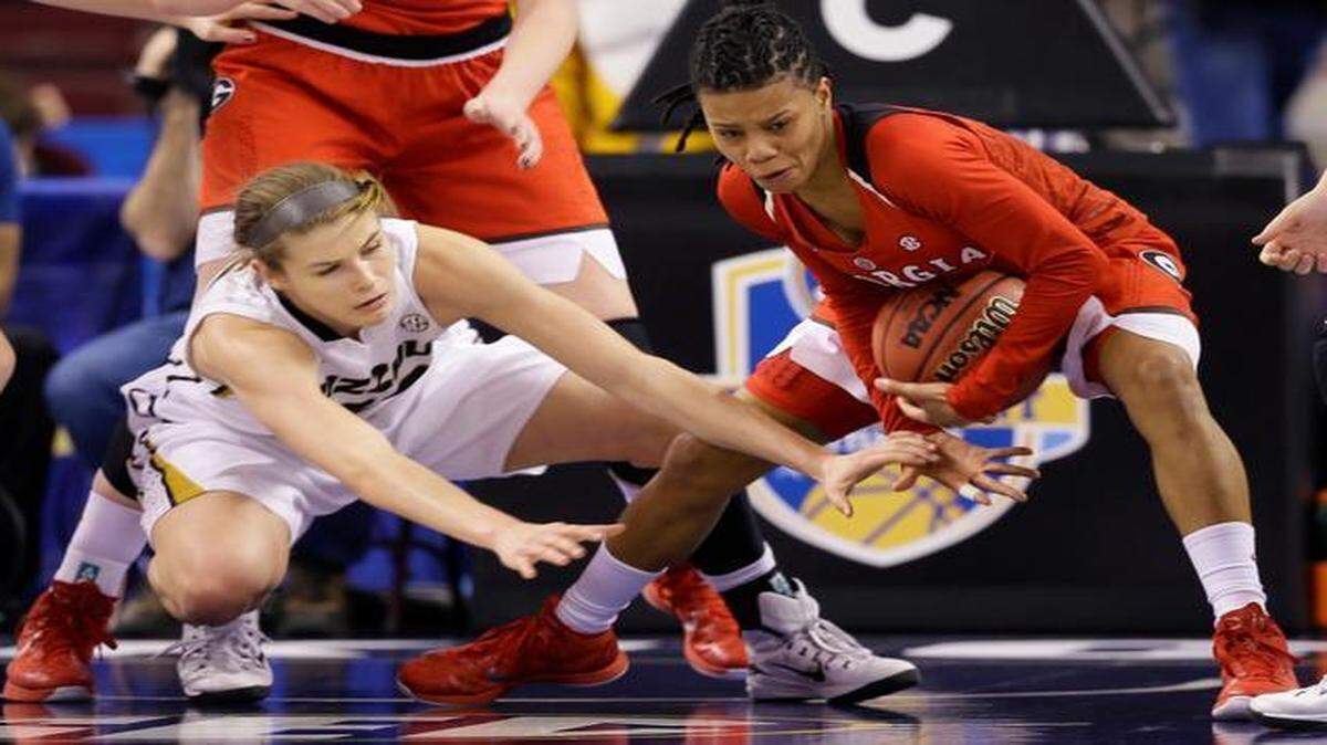 
Georgia's Tiaria Griffin (right) picks up a rebound next to Missouri's Jordan Frericks during their March 5 SEC women's tournament game in North Little Rock, Ark.

