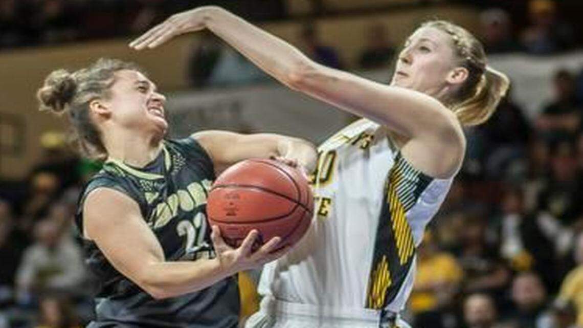 
Emporia State’s Jacee Kramer was fouled on this shot attempt by Fort Hays State’s Kate Lehman during Sunday’s game.
