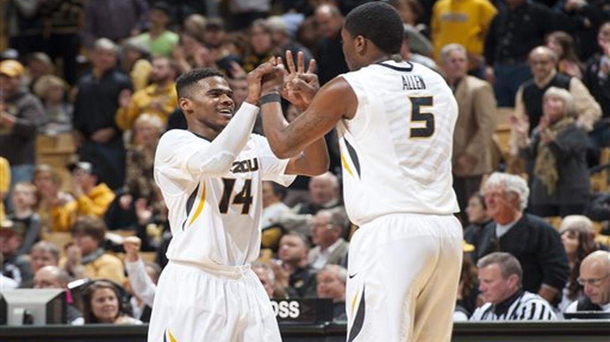 
Missouri's Keith Shamburger, left, celebrates with teammate D'Angelo Allen after Allen made a three-point shot late during the second half of an NCAA college basketball game against Southeast Missouri State, Tuesday, Dec. 2, 2014, in Columbia, Mo. Missouri won 65-61. (AP Photo/L.G. Patterson)
