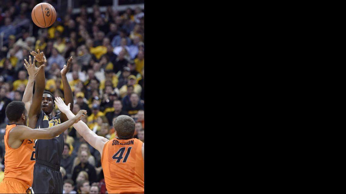 
MU's Montaque Gill-Caesar shoots over a pair of OSU defenders, including Mitchell Solomon (41) during the first half of Tuesday night's game at the Sprint Center in Kansas City.
