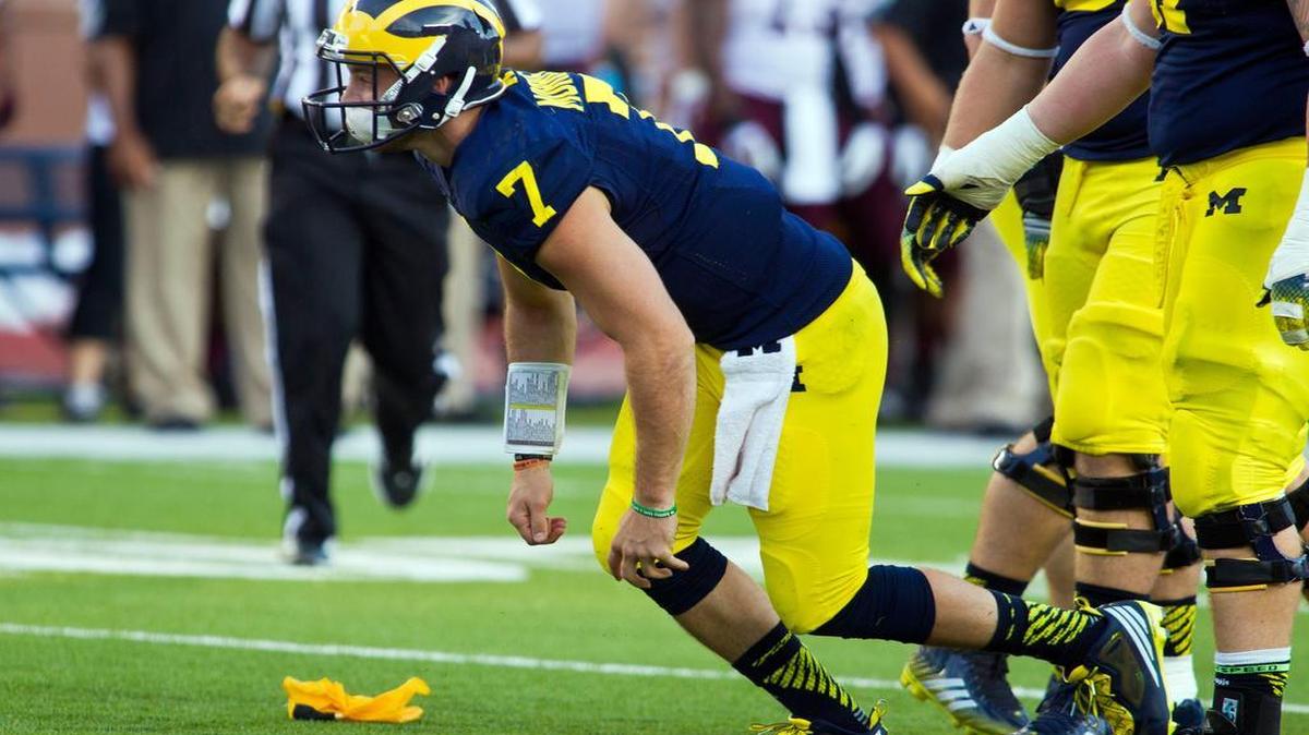 
In this Sept. 27, 2014, photo, Michigan quarterback Shane Morris got up from the field after taking a hit in the fourth quarter in Ann Arbor, Mich. On Sept. 30, 2014, roughly 12 hours after embattled Michigan coach Brady Hoke said he’d been given no indication that Morris had been diagnosed with a concussion, athletic director Dave Brandon revealed in a post-midnight statement that the sophomore did appear to have sustained one.
