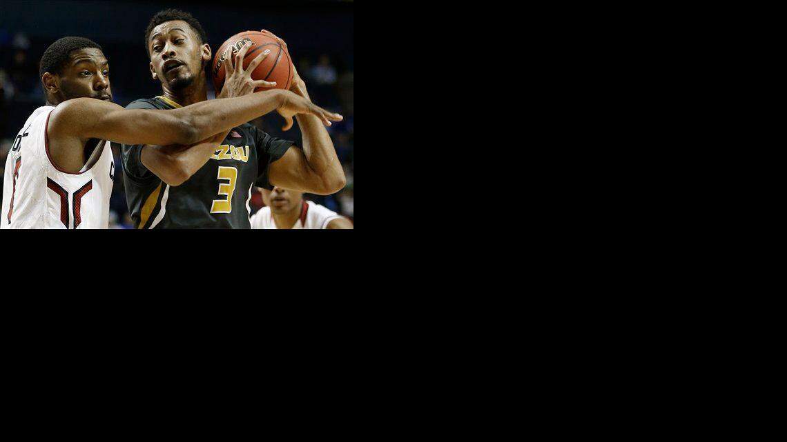 
Missouri forward Johnathan Williams III (right) moved by South Carolina guard Sindarius Thornwell in the first round of the Southeastern Conference Tournament on March 11 in Nashville, Tenn. 