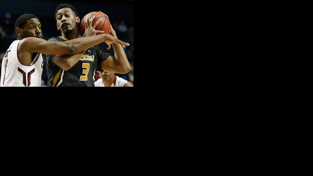 
Missouri forward Johnathan Williams III (right) moved by South Carolina guard Sindarius Thornwell in the first round of the Southeastern Conference Tournament on March 11 in Nashville, Tenn. 