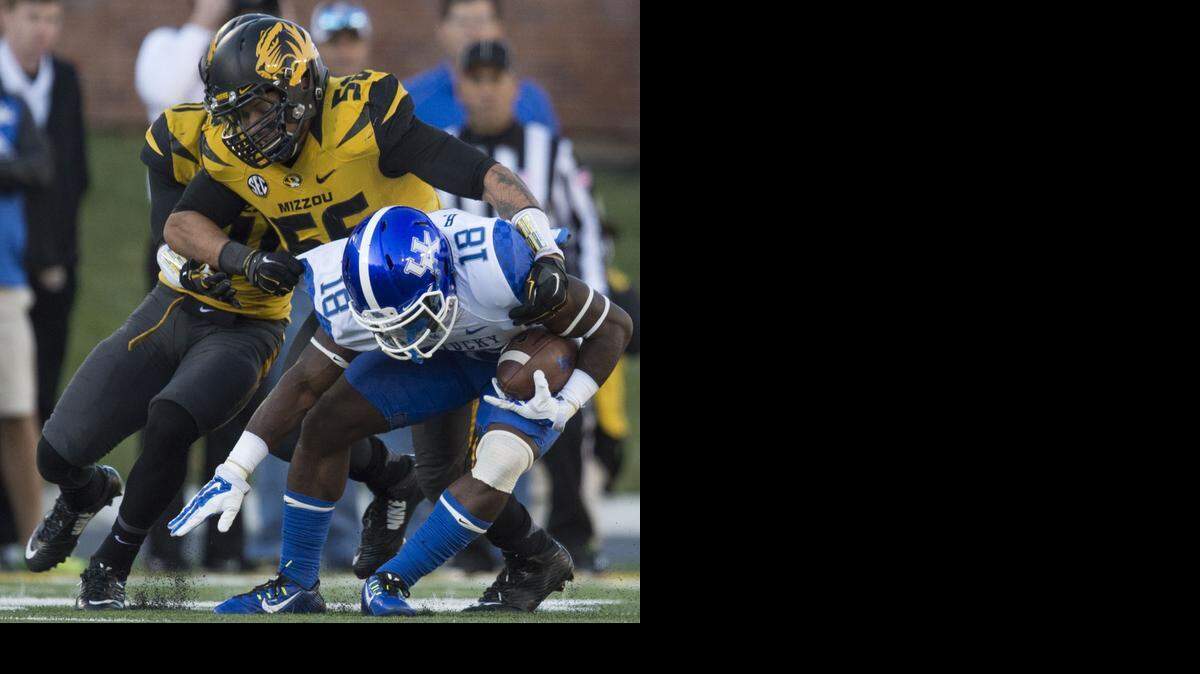 
Missouri Tigers defensive lineman Shane Ray (56) drops Kentucky Wildcats running back Stanley Williams (18) in the third quarter during Saturday's Univeristy of Missouri and University of Kentucky SEC football game at Faurot Field on Nov. 1, 2014 in Columbia, Missouri. Missouri beat Kentucky 20-10.
