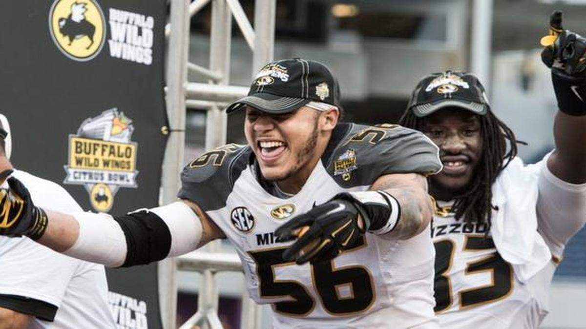 
Missouri’s Shane Ray (left) and Missouri Tigers Markus Golden celebrated while waiting for trophy presentations after the the Tiger beat Minnesota 33-17 in the Citrus Bowl.
