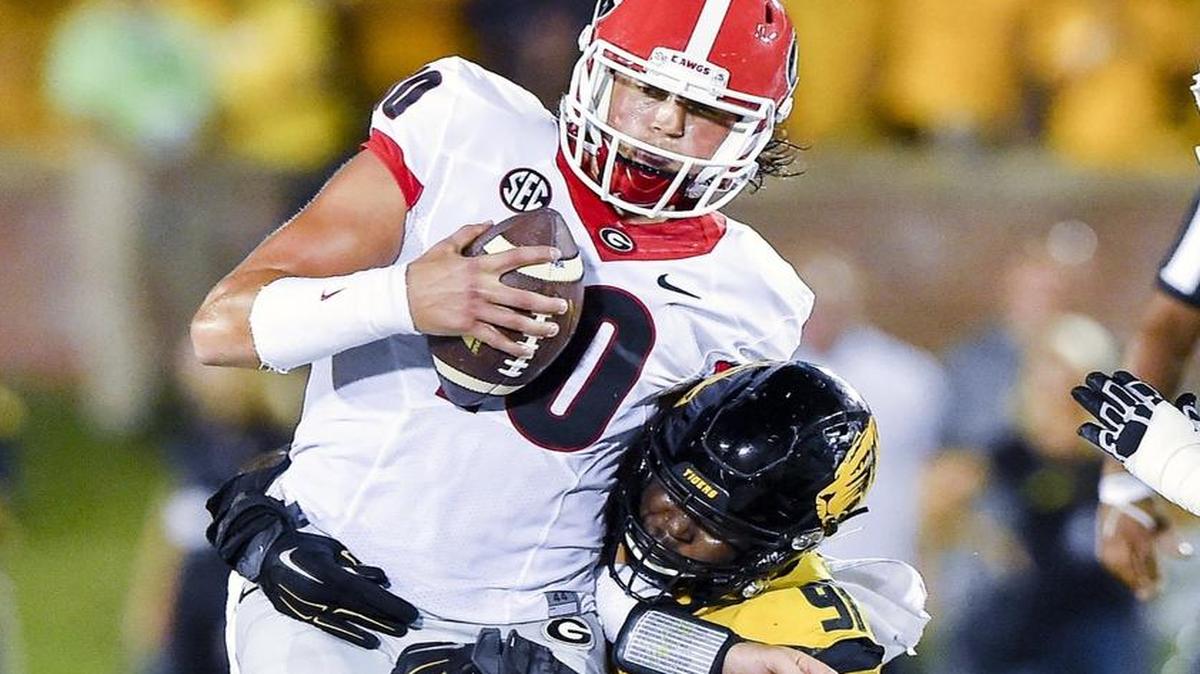 Tigers defensive end Charles Harris sacked Bulldogs quarterback Jacob Eason during the first half Saturday night.