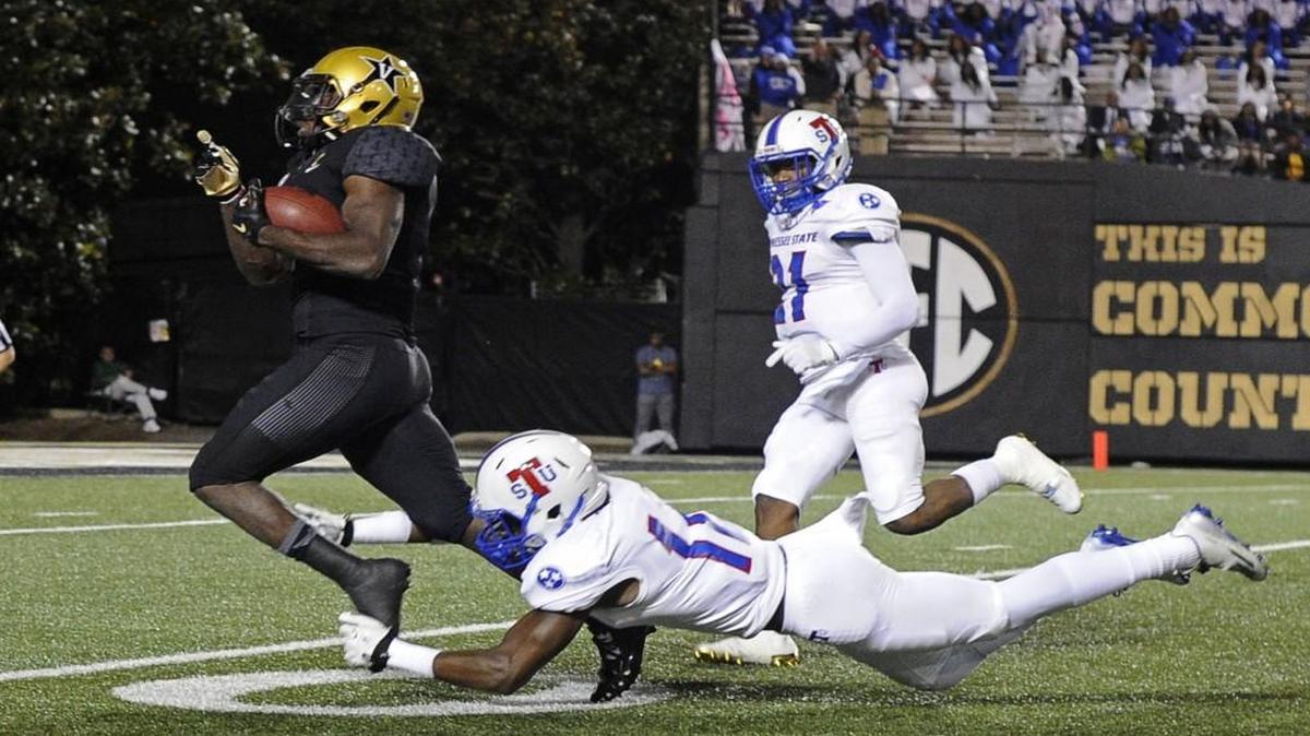 Vanderbilt running back Ralph Webb slipped by Tennessee State safety Larry Wilhoite during a game last month.