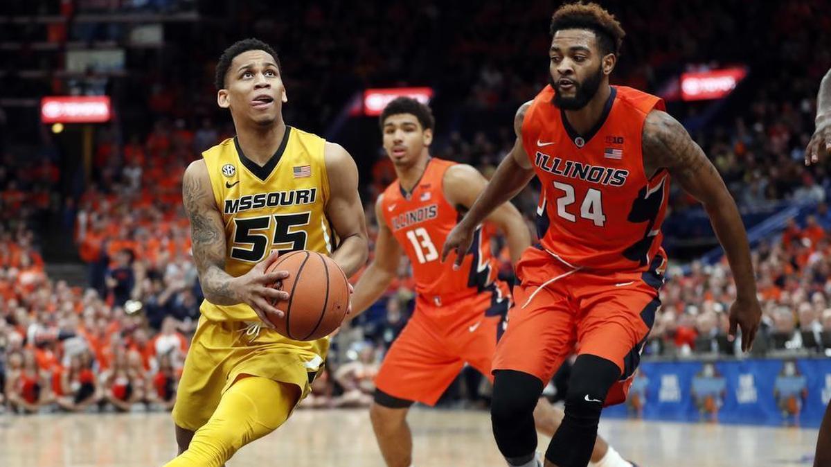 Missouri's Blake Harris (55) heads to the basket as Illinois' Mark Smith (13) and Mark Alstork (24) defend during the second half of a game on Saturday, Dec. 23, 2017, in St. Louis.