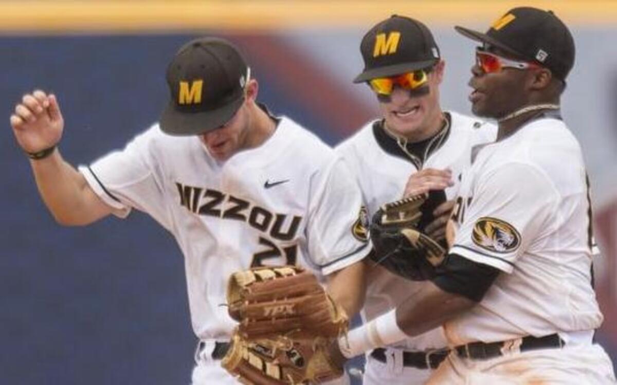 
Missouri’s Jake Ivory, Jake Ring and Trey Harris celebrated after the Tigers beat South Carolina 5-1 in the first round of the SEC Baseball Tournament on Tuesday at the Hoover Met in Hoover, Ala.
