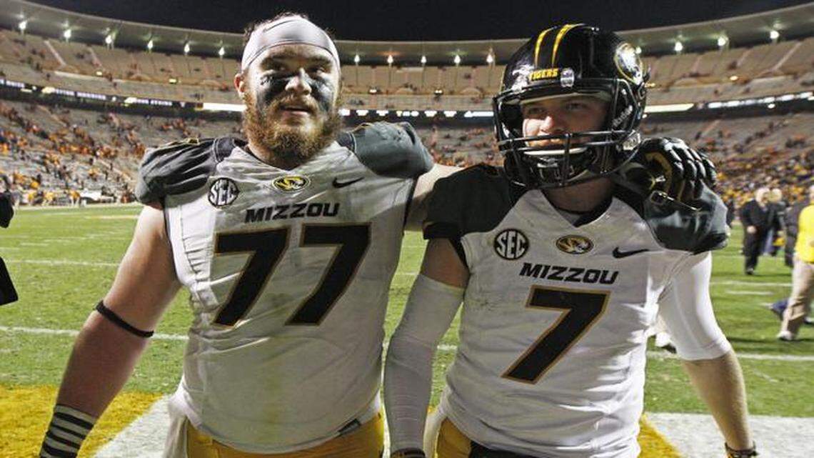 
Missouri offensive lineman Evan Boehm (77) celebrates with quarterback Maty Mauk (7) after an NCAA college football game against Tennessee Saturday, Nov. 22, 2014 in Knoxville, Tenn. Missouri won 29-21.
