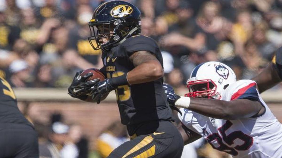 Missouri running back Chase Abbington 9with ball) decided to leave the program after rarely playing last season.