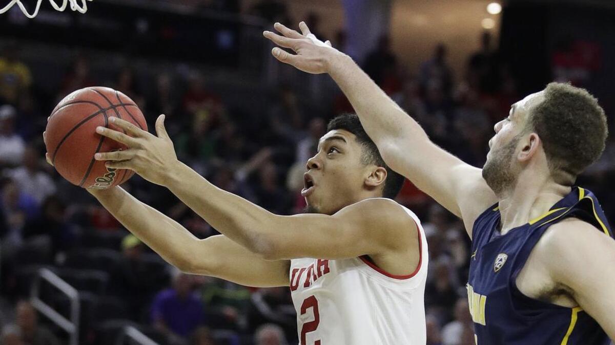 FILE - In this March 9, 2017, file photo, Utah’s Sedrick Barefield shoots around California’s Kameron Rooks during the first half of an NCAA college basketball game in the quarterfinals of the Pac-12 men’s tournament in Las Vegas.