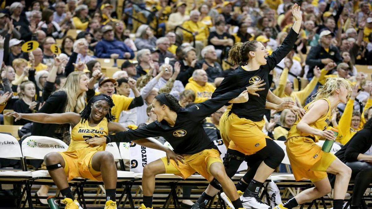 Missouri’s Amber Smith, Jordan Roundtree, Kayla McDowell and Lindsey Cunningham cheer from the bench during the second half of the Tigers’ 100-65 win against Mississippi on Thursday.