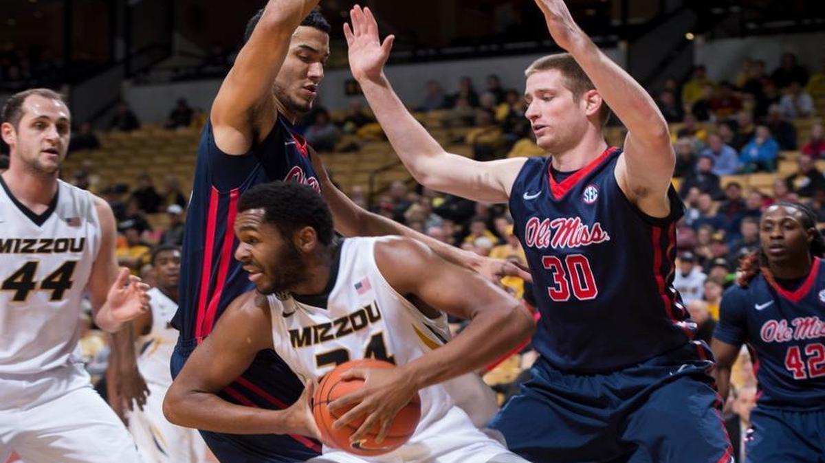 Missouri’s Kevin Puryear (center) looked for help as he was guarded by Mississippi’s Jake Coddington (right) and Anthony Perez in the first half Wednesday night at Mizzou Arena in Columbia.