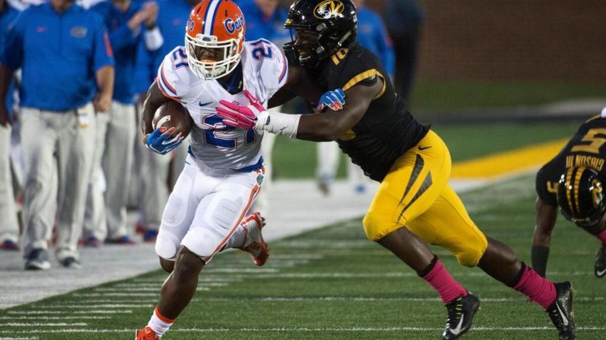 
Missouri’s Kentrell Brothers (right) pushed Florida running back Kelvin Taylor out of bounds in the first half Saturday night in Columbia. Brothers finished with 15 tackles.
