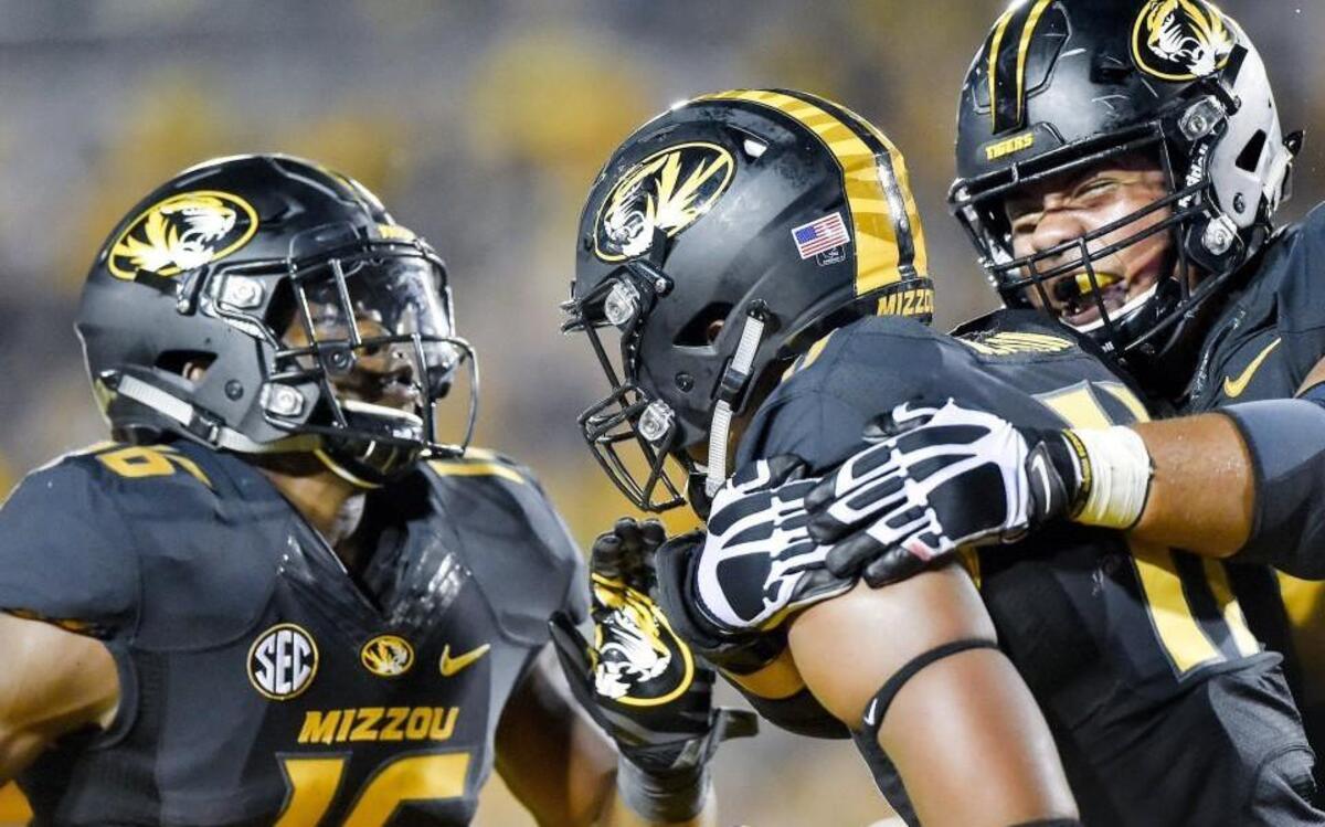 Missouri Tigers tight end Kendall Blanton (middle) was surrounded by his teammates running back Damarea Crockett (left) and offensive lineman Kevin Pendleton after Blanton scored a touchdown during a game against Eastern Michigan last season.