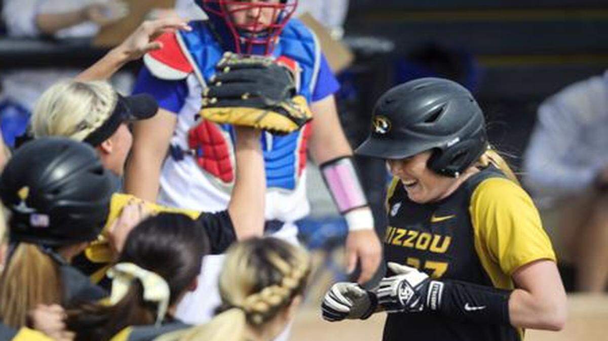 
Missouri's Kirsten Mack (27) is greeted by teammates at home plate after hitting a home run against Kansas in last month’s NCAA softball tournament regional in Columbia. The Tiger softball team is to get a new stadium under the university’s master plan.
