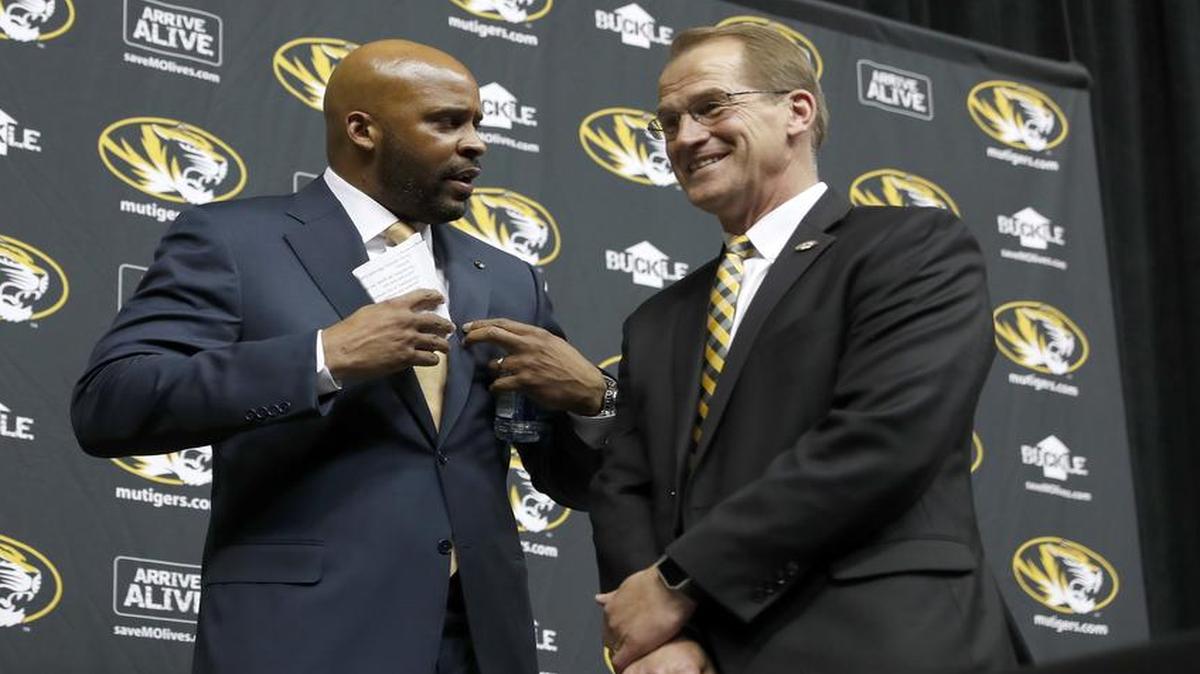 Cuonzo Martin, left, talks with Missouri athletic director Jim Sterk after being formally introduced as the new head basketball coach at the University of Missouri Monday, March 20, 2017, in Columbia, Mo.
