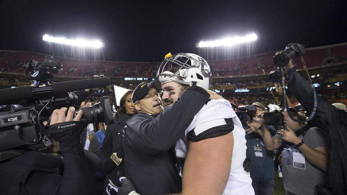 Missouri Tigers head coach Gary Pinkel shared a hug with Missouri Tigers offensive lineman Connor McGovern during Saturday's game at Arrowhead Stadium.