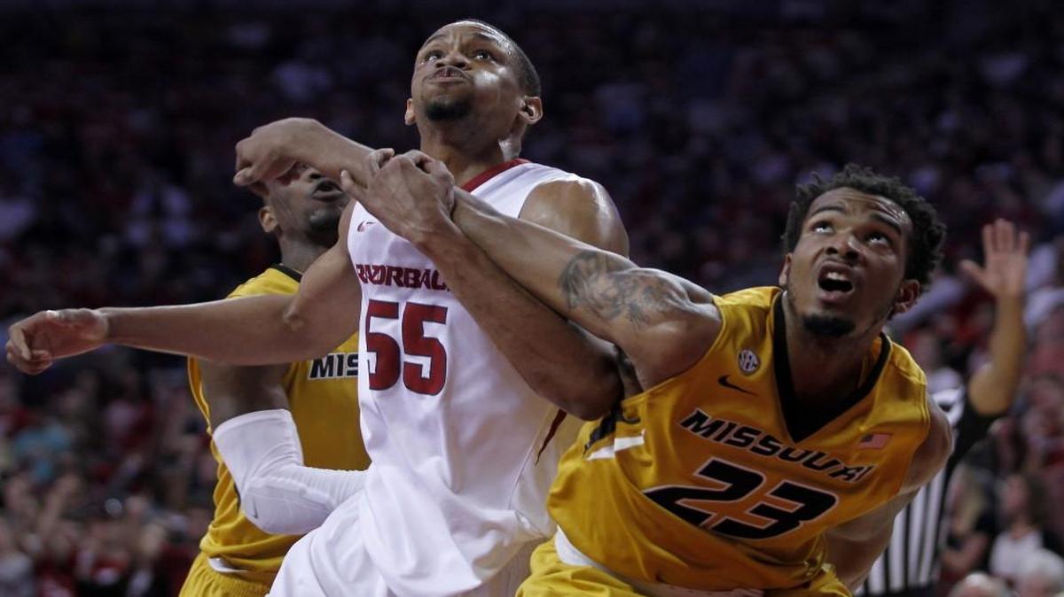 Missouri’s Jakeenan Gant (right) and Arkansas’ Keaton Miles battled for position as they eyed a rebound during a game in February.