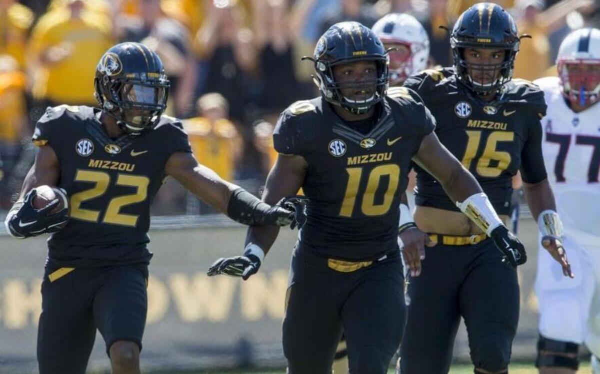 
Missouri defensive back Anthony Sherrils (22) pointed where he needed a block as teammates Kentrell Brothers (10) and Brock Bondurant (16) provided an escort after Sherrils intercepted the ball in the end zone during a failed fake field goal attempt late in the fourth quarter of Saturday’s game against Connecticut at Faurot Field. Missouri beat Connecticut 9-6.

