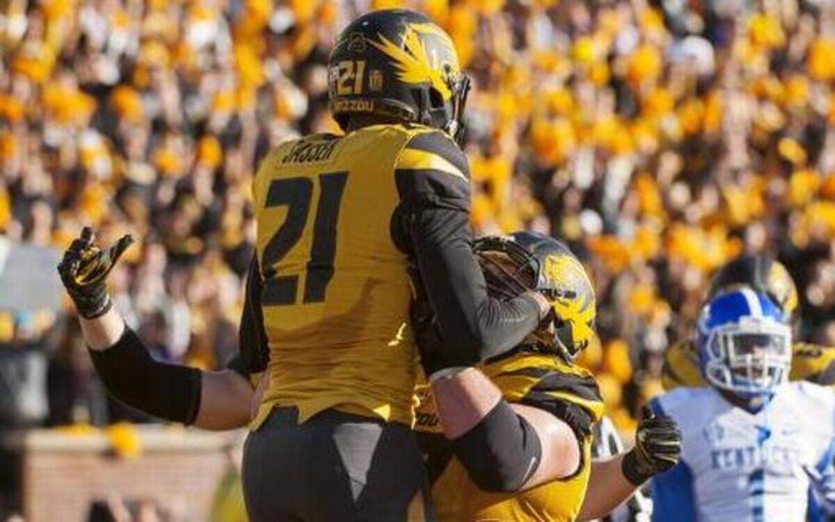 
Missouri wide receiver Bud Sasser was hoisted in the air by teammate Evan Boehm after Sasser scored a touchdown on Saturday.
