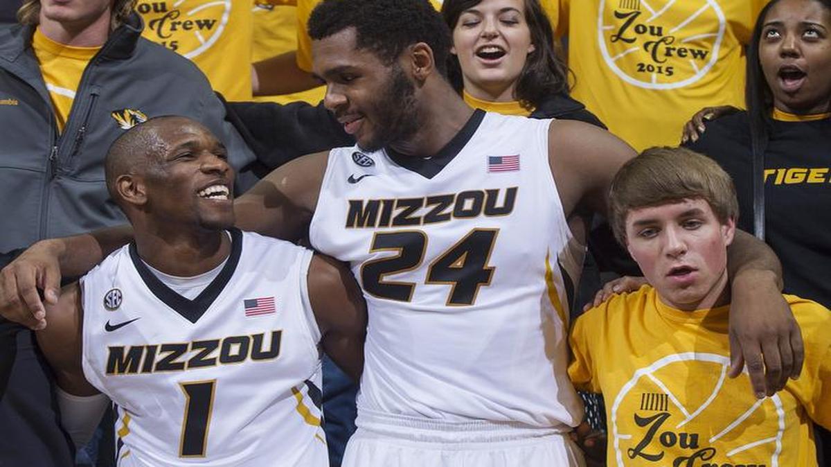 Missouri’s Terrence Phillips (left) and Kevin Puryear celebrated with fans in the crowd after beating Wofford 83-74 in the season-opener.