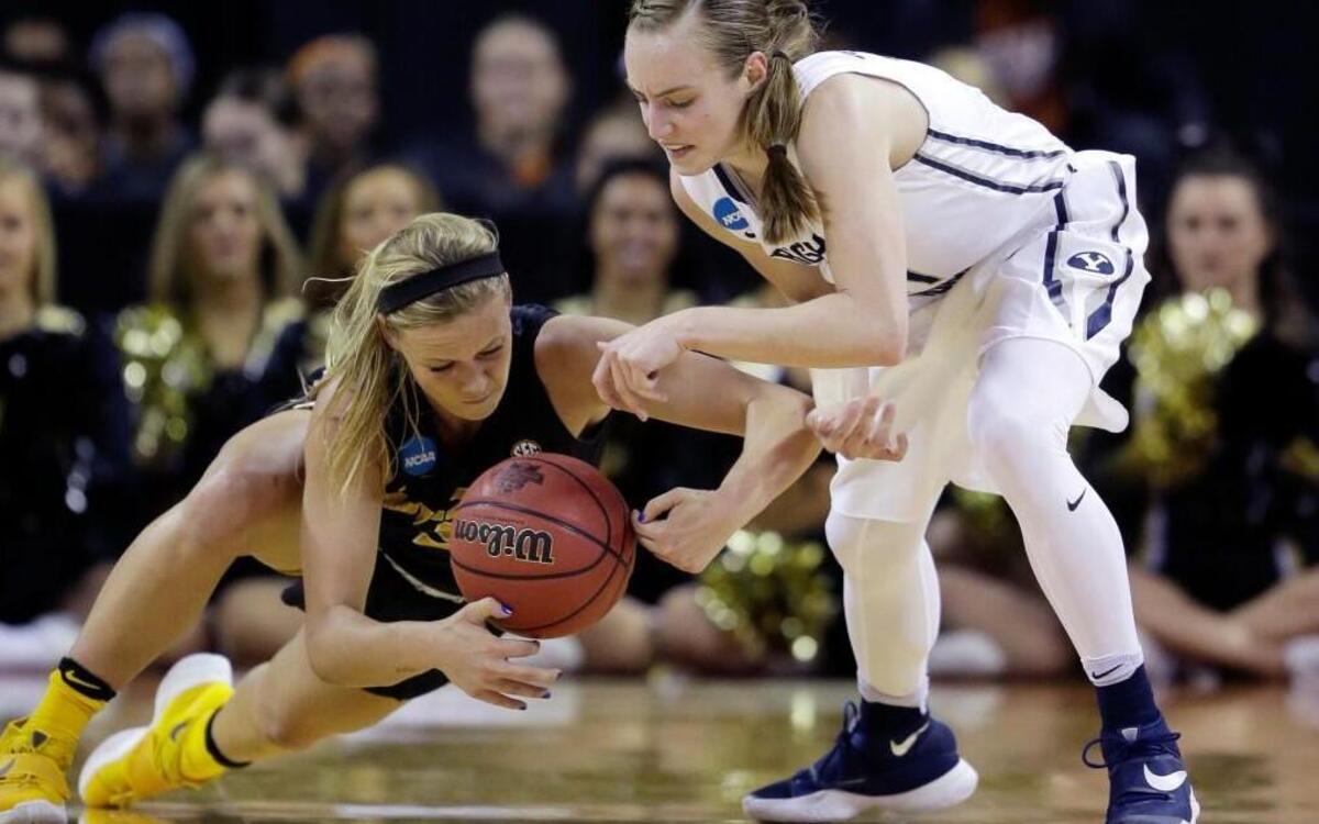 Missouri’s Sophie Cunningham (left) and BYU’s Lexi Eaton Rydalch scrambled for a loose ball during Saturday’s first-round women's college basketball game in the NCAA Tournament in Austin, Texas.