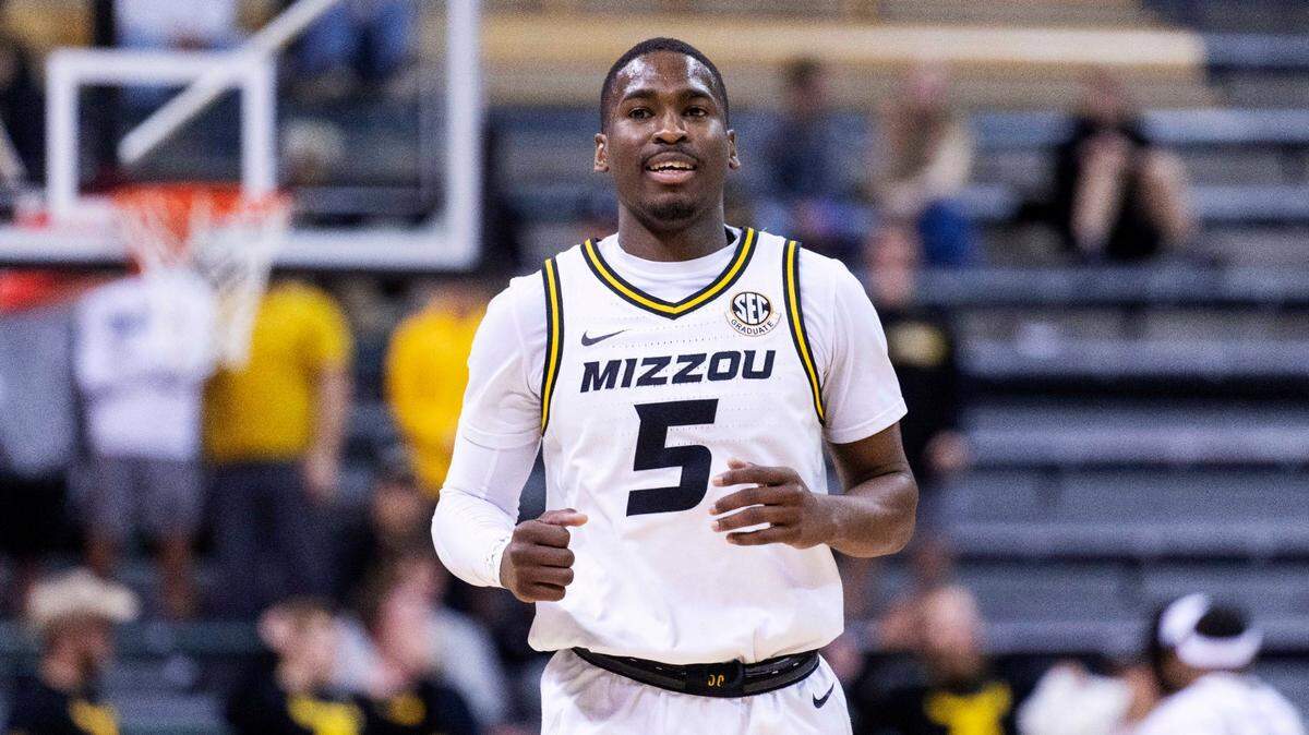 D’Moi Hodge smiles as he runs up court during the second half against Coastal Carolina on Nov. 23, 2022, in Columbia. Missouri defeated Coastal Carolina and followed that game with a win over Houston Christian.