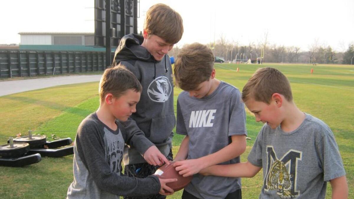 J.T. Odom, Garyt Odom, Garyt Kurowski and Ben Odom, sons of Mizzou football coaches and administrators, take time out for some fun recently in Columbia.