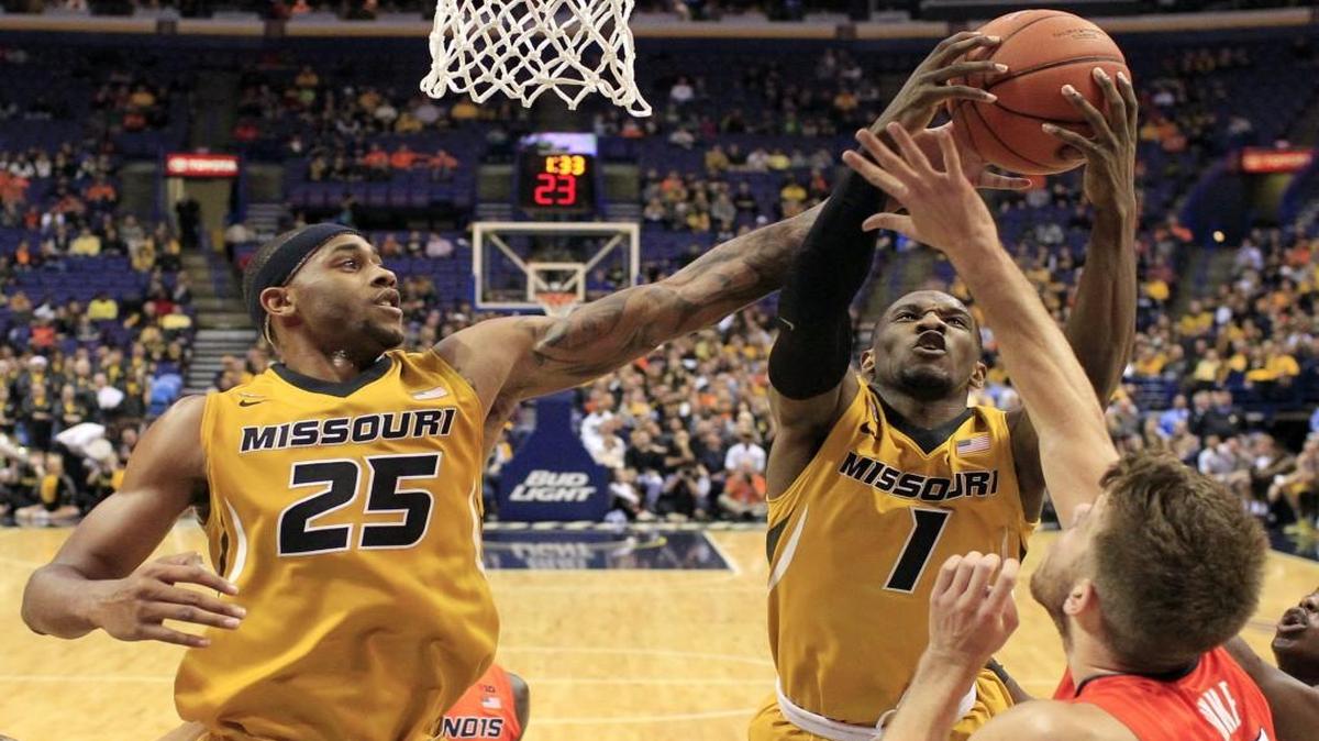 Missouri's Russell Woods (25) and Terrence Phillips (1) reach for a rebound in front of Illinois' Michael Finke (right) during last week’s game in St. Louis.